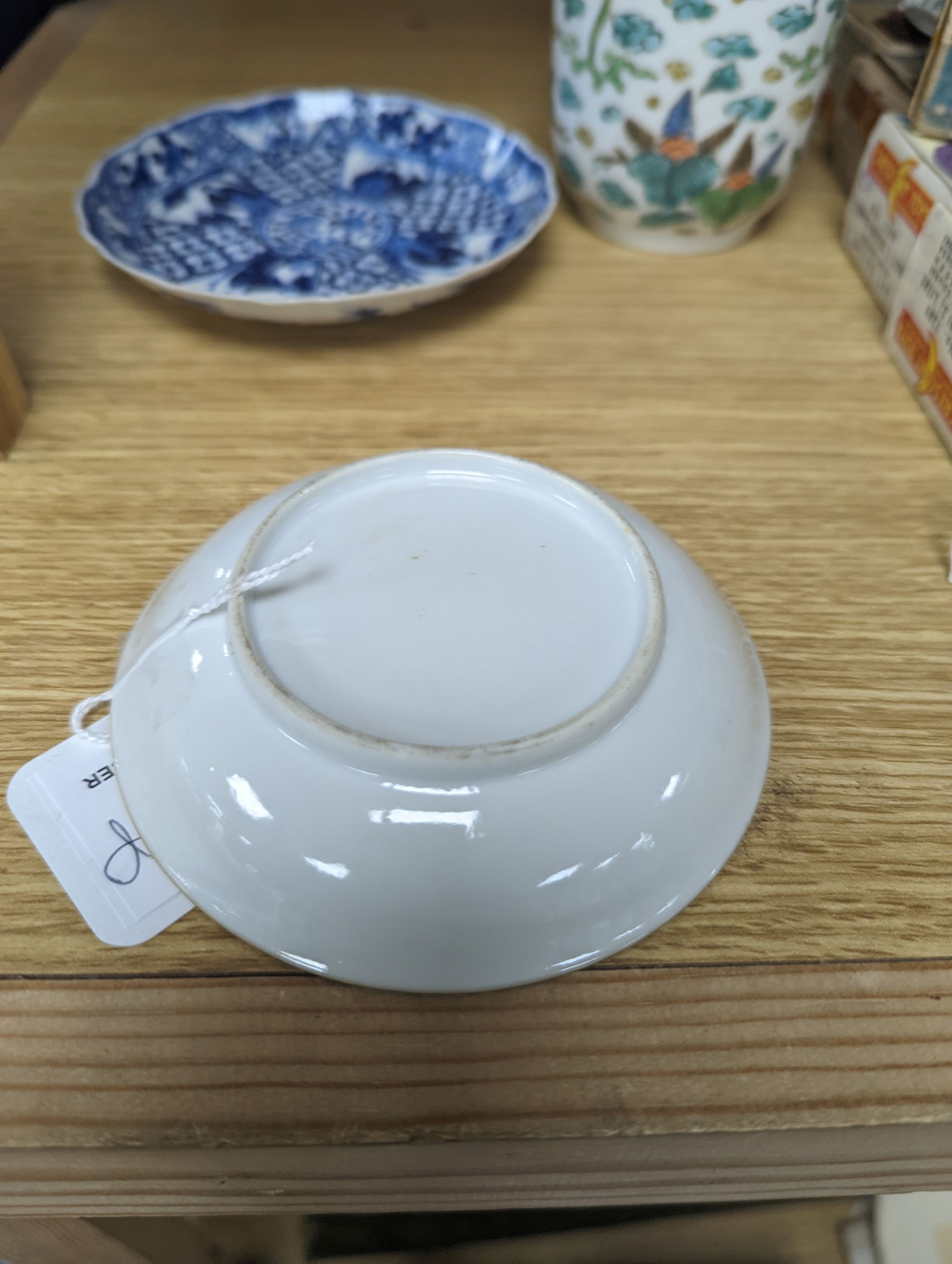 Two Chinese porcelain saucer dishes and an enamelled porcelain vase, 18th century and later, 12.5cm